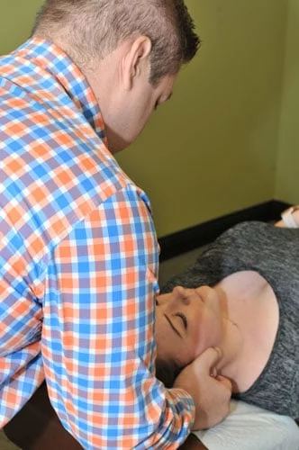 Merrillville Chiropractor John McDonald Adjusting Patient