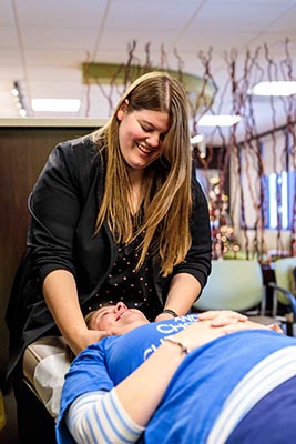 Chiropractor Crown Point IN Kelsi Dimitt with a Patient