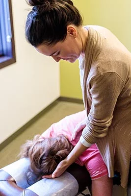 Chiropractor Crown Point IN Kristina Kauffman with Patient